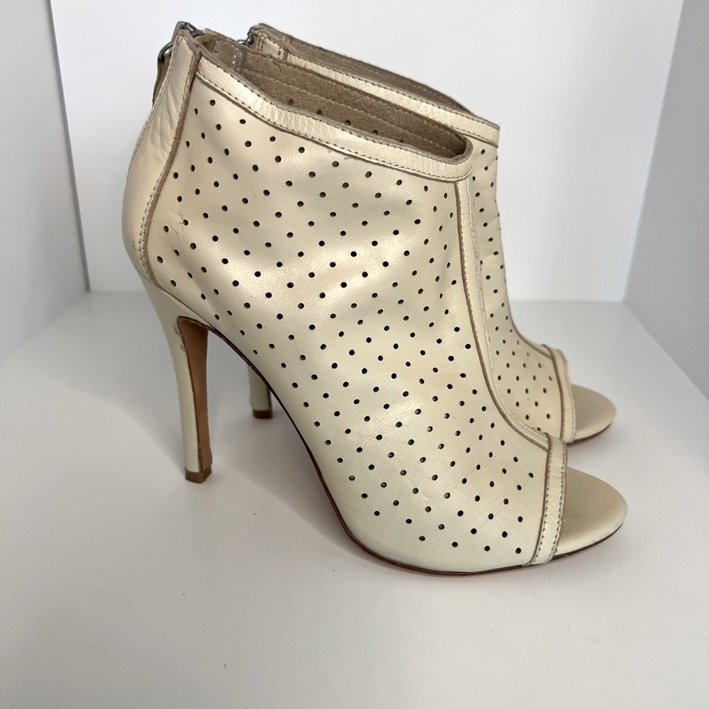 Alice and Olivia high heel booties in cream color.